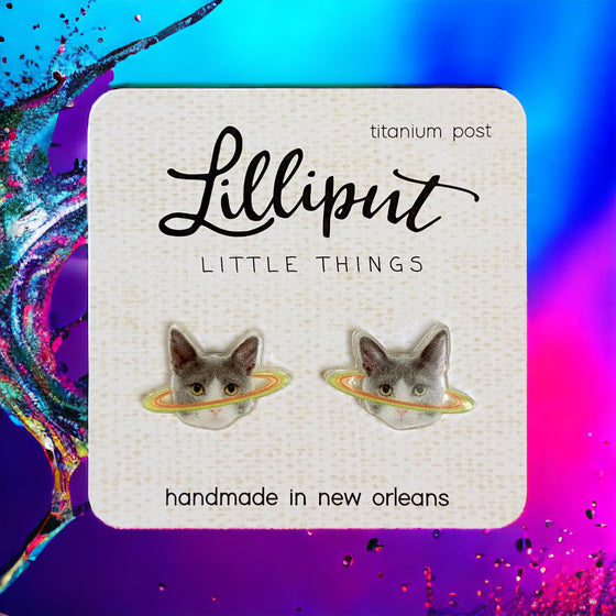 Lilliput Little Things Caturn Earrings Handmade New Orleans with colorful background
