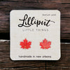 Lilliput Little Things Handmade Maple Leaf Earrings on wood background - Front View